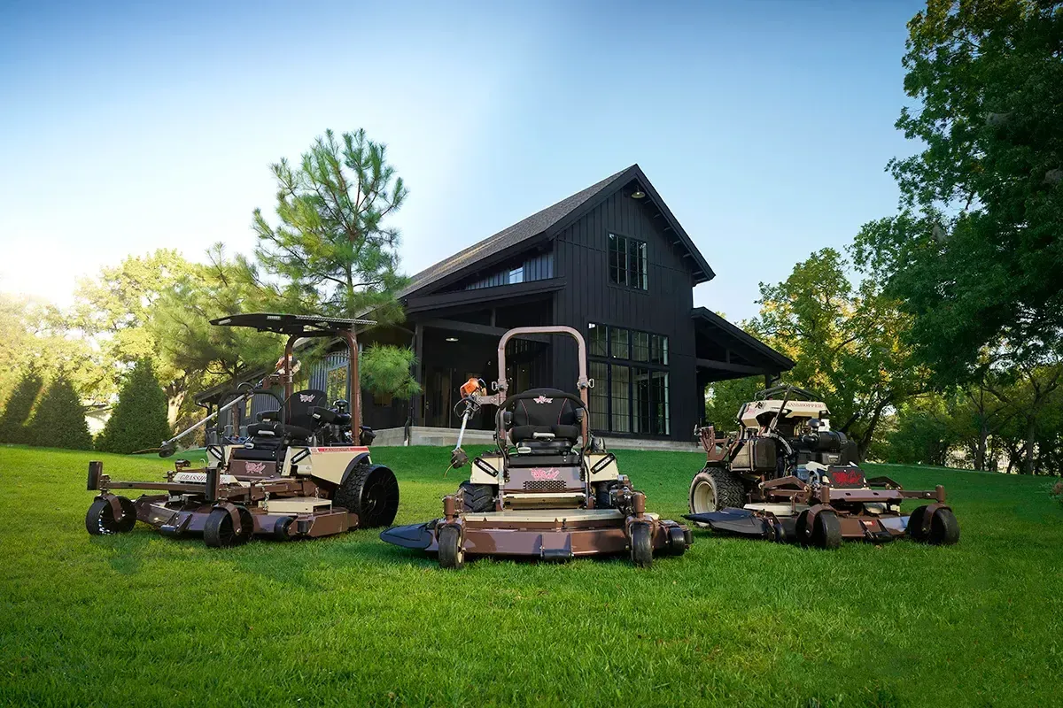 Grasshopper zero-turn mower lineup outside the barn